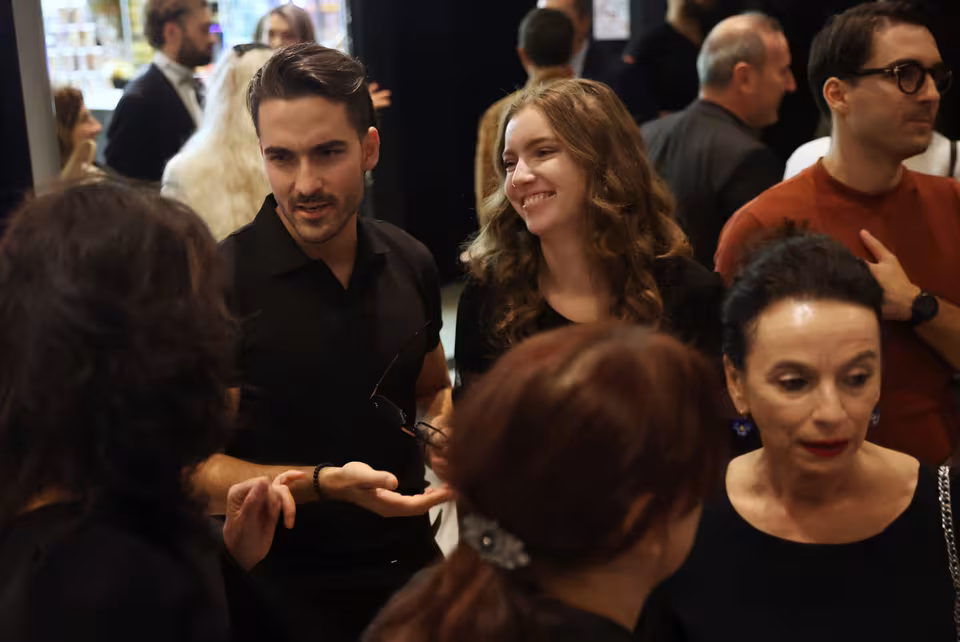 Guests mingling in the foyer