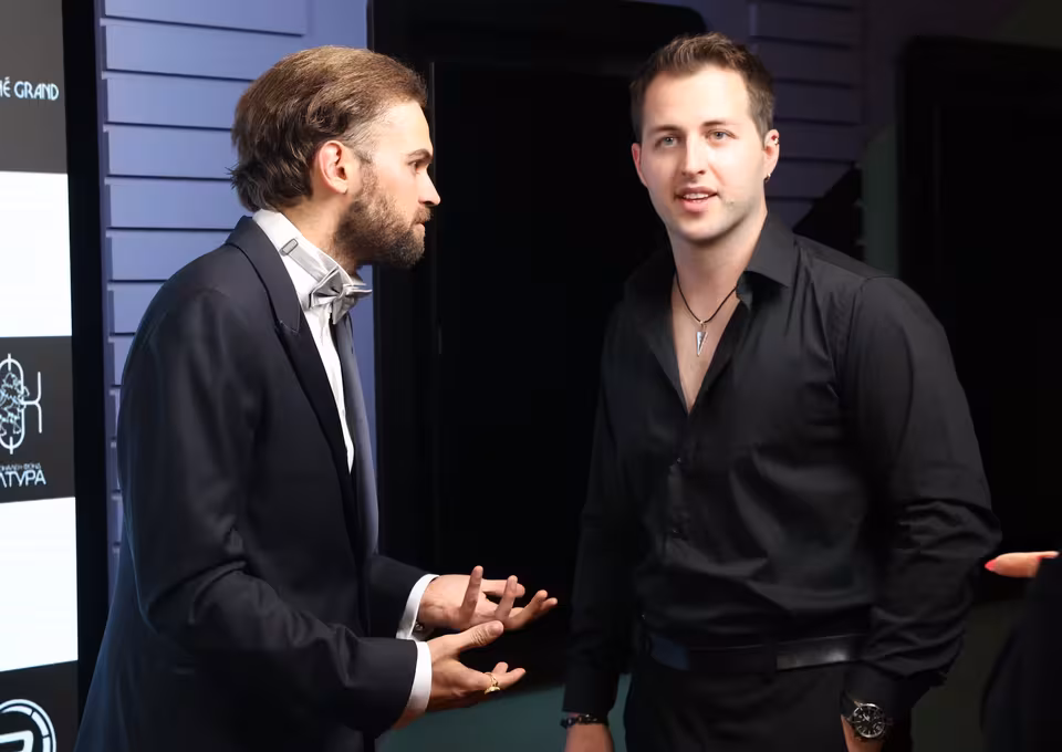 Two guests talking backstage